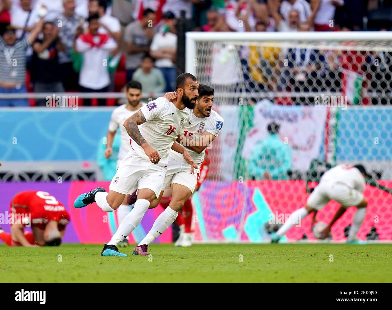 Iran's Roozbeh Cheshmi (left) celebrates scoring their side's first goal of the game during the FIFA World Cup Group B match at the Ahmad Bin Ali Stadium, Al-Rayyan. Picture date: Friday November 25, 2022. Stock Photo