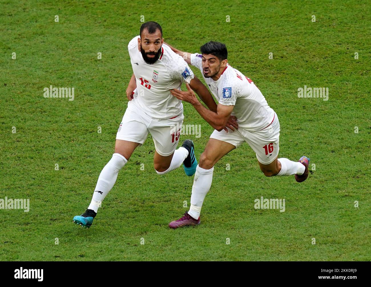 Iran's Roozbeh Cheshmi celebrates scoring the opening goal with team mate Mehdi Torabi during the FIFA World Cup Group B match at the Ahmad Bin Ali Stadium, Al-Rayyan. Picture date: Friday November 25, 2022. Stock Photo