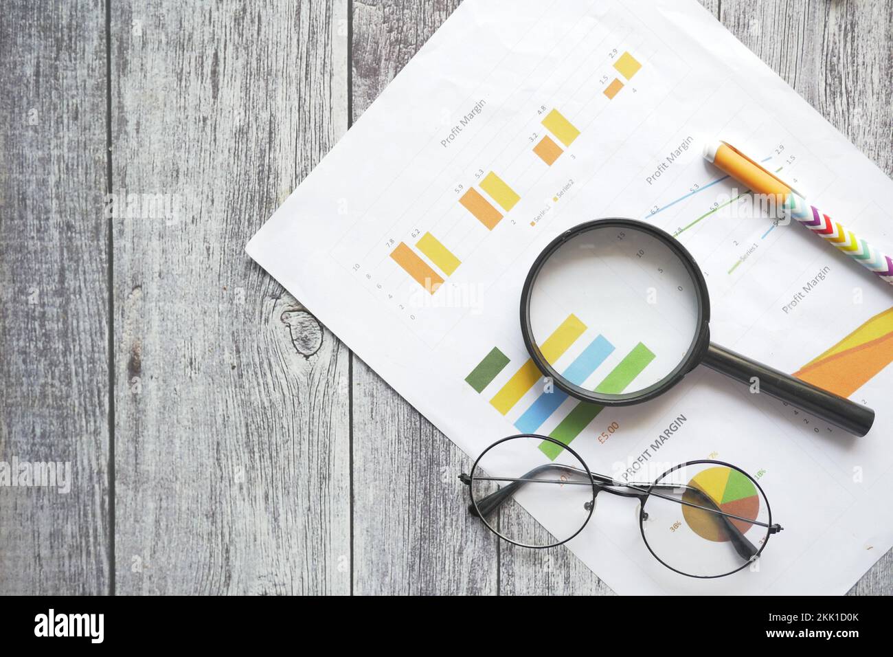 financial graph, calculator and notepad on table  Stock Photo