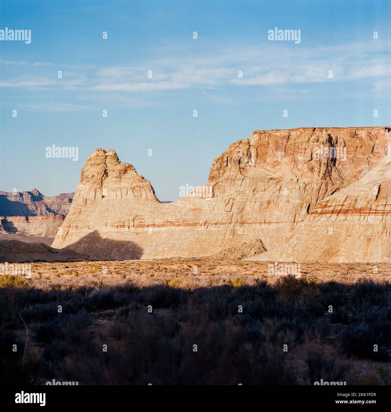 A beautiful shot of rocky canyons in the desert under blue cloudy sky ...