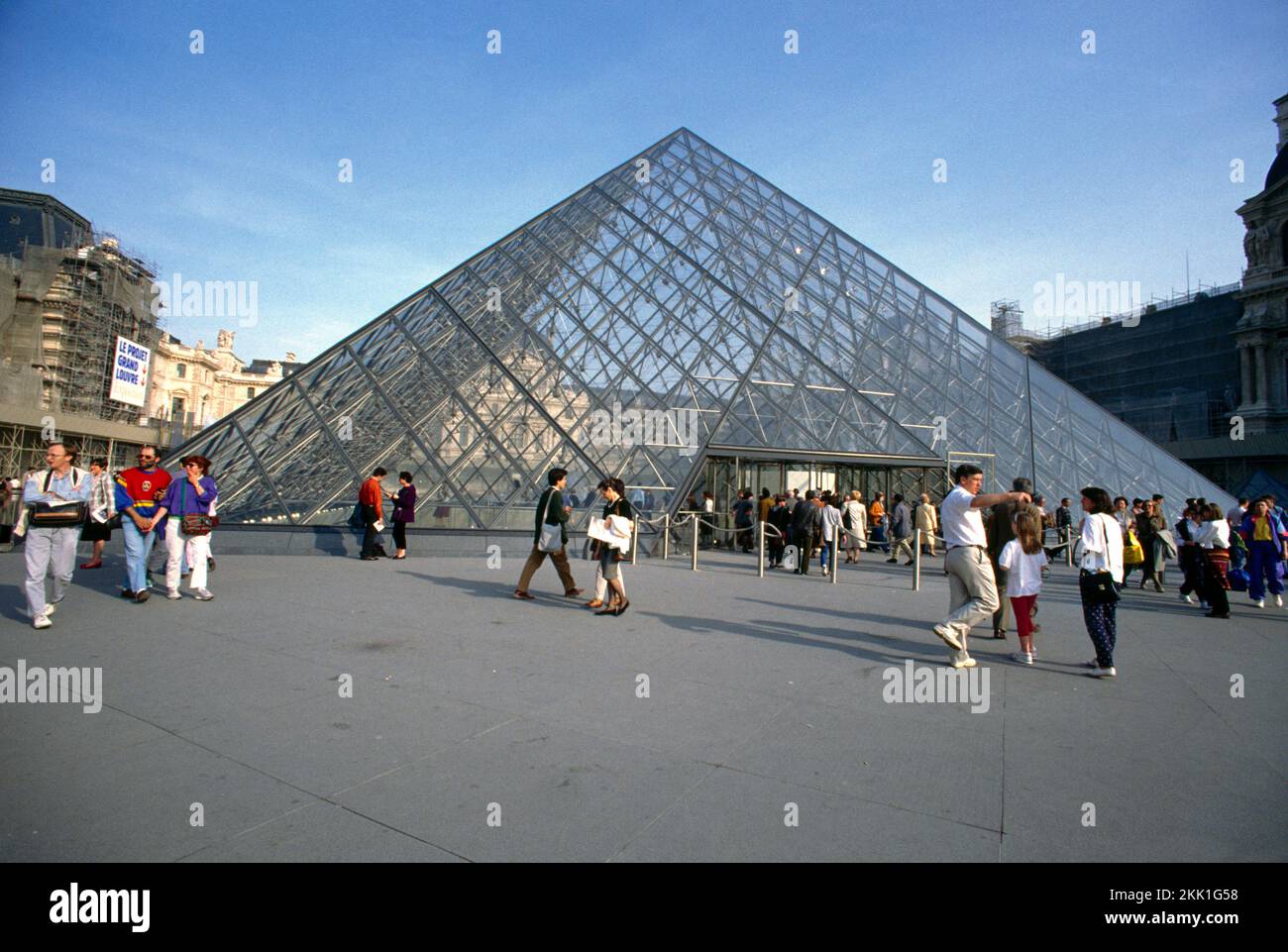 Paris France Louvre Pei Pyramid and Visitors Stock Photo