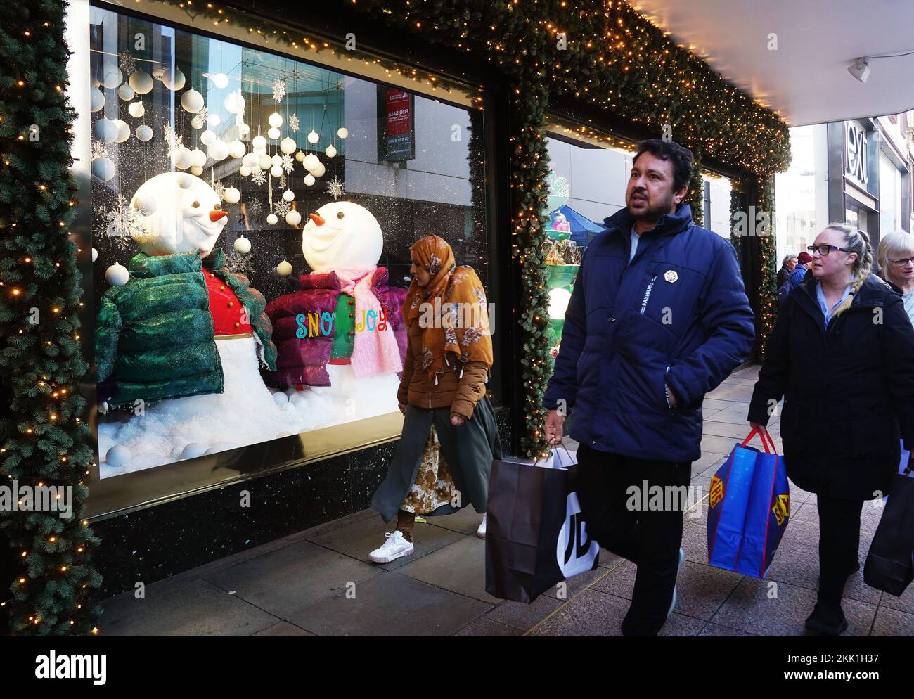 Shoppers pass by the Arnotts Christmas window display on Henry street