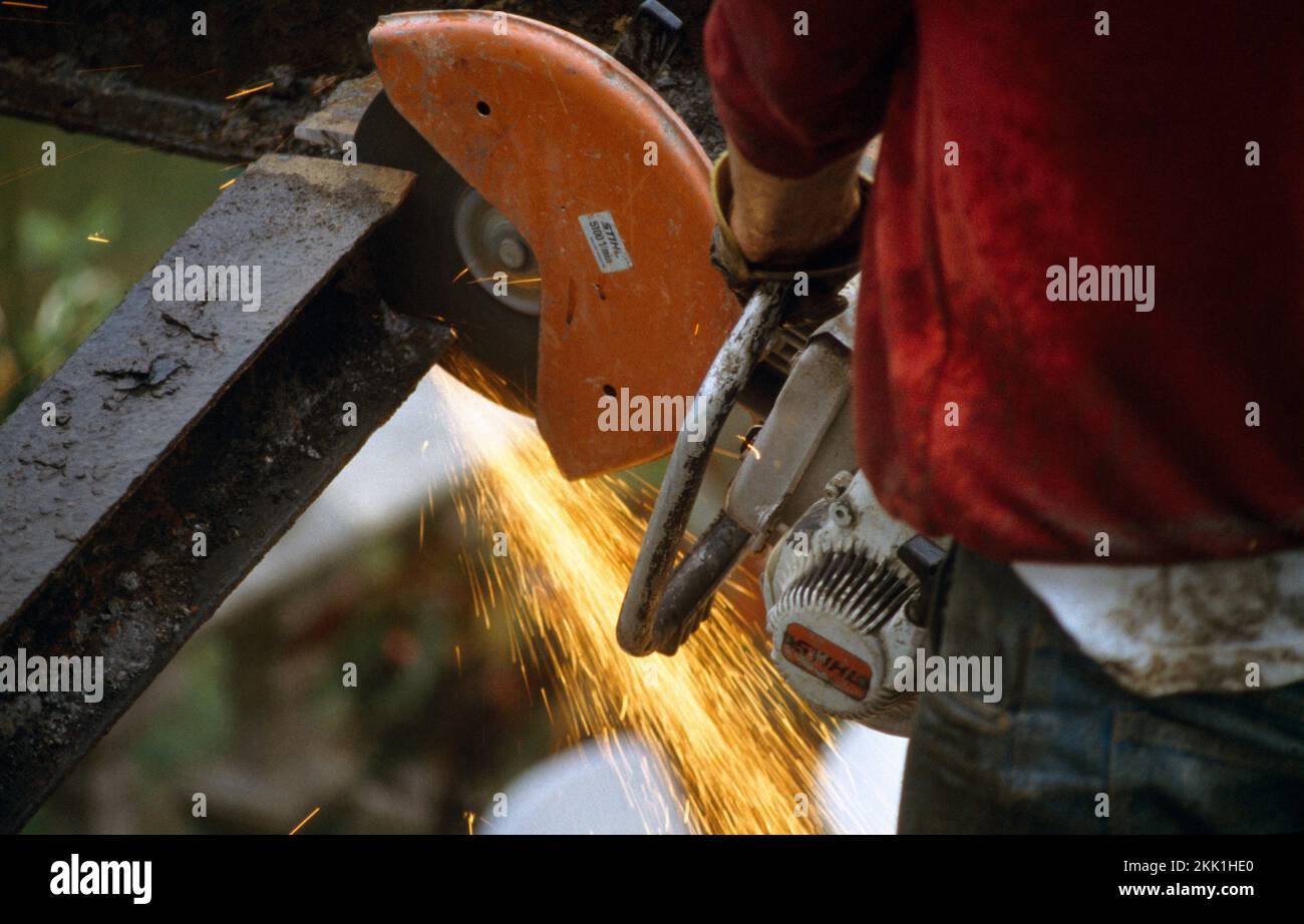 Workman Building Conservatory Close up of Circular Saw Cutting Iron Beam Stock Photo