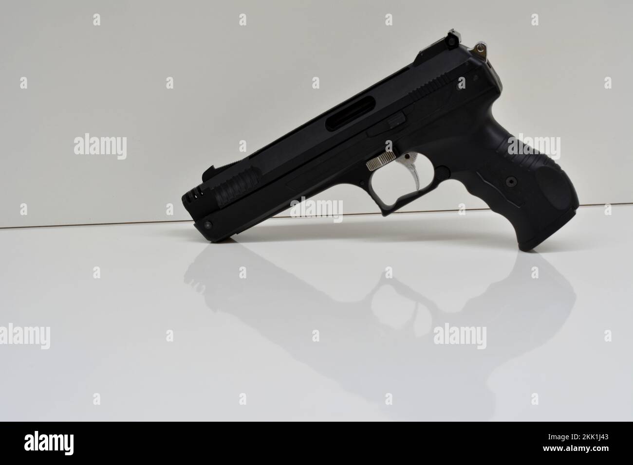 Pressure gun. Black color with white base and white background. Copy space. Stock Photo