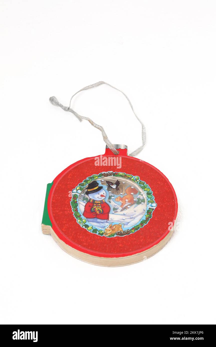 A Child's Christmas Book as a Decoration Bauble Stock Photo