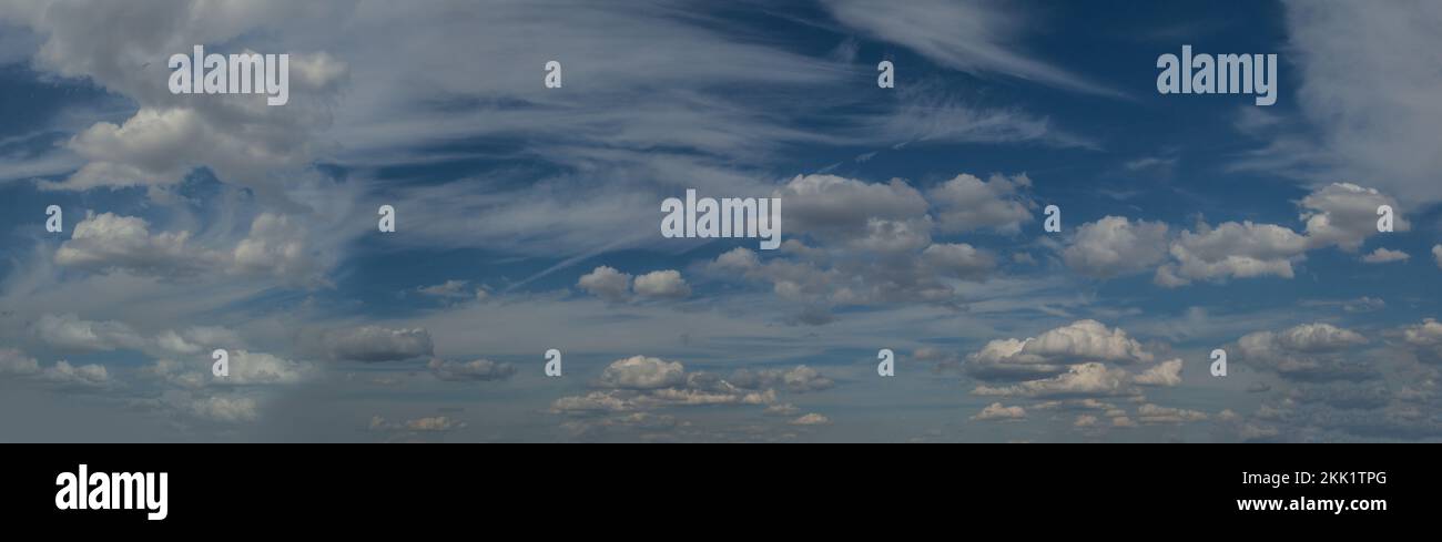White fluffy clouds floating in blue sky, panoramic sky background ...