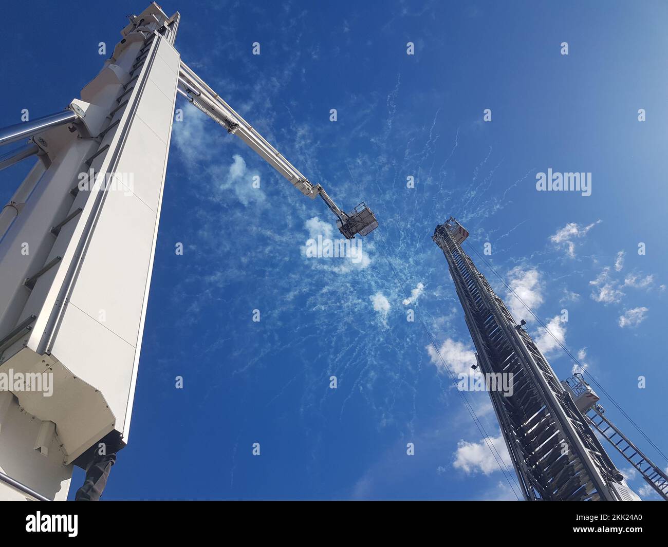 Crane construction on the cloudy blue sky background Stock Photo - Alamy