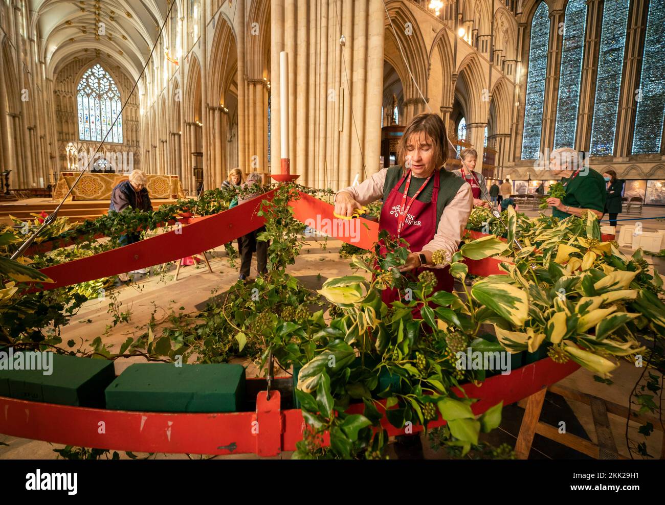 Finishing touches are made to the Advent wreath before it is raised to its traditional position below the Central Tower at York Minster. Picture date: Friday November 25, 2022. Stock Photo