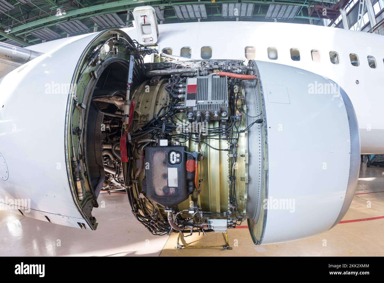 Close-up of an open high-bypass turbofan aircraft engine of a passenger airplane in a hangar Stock Photo