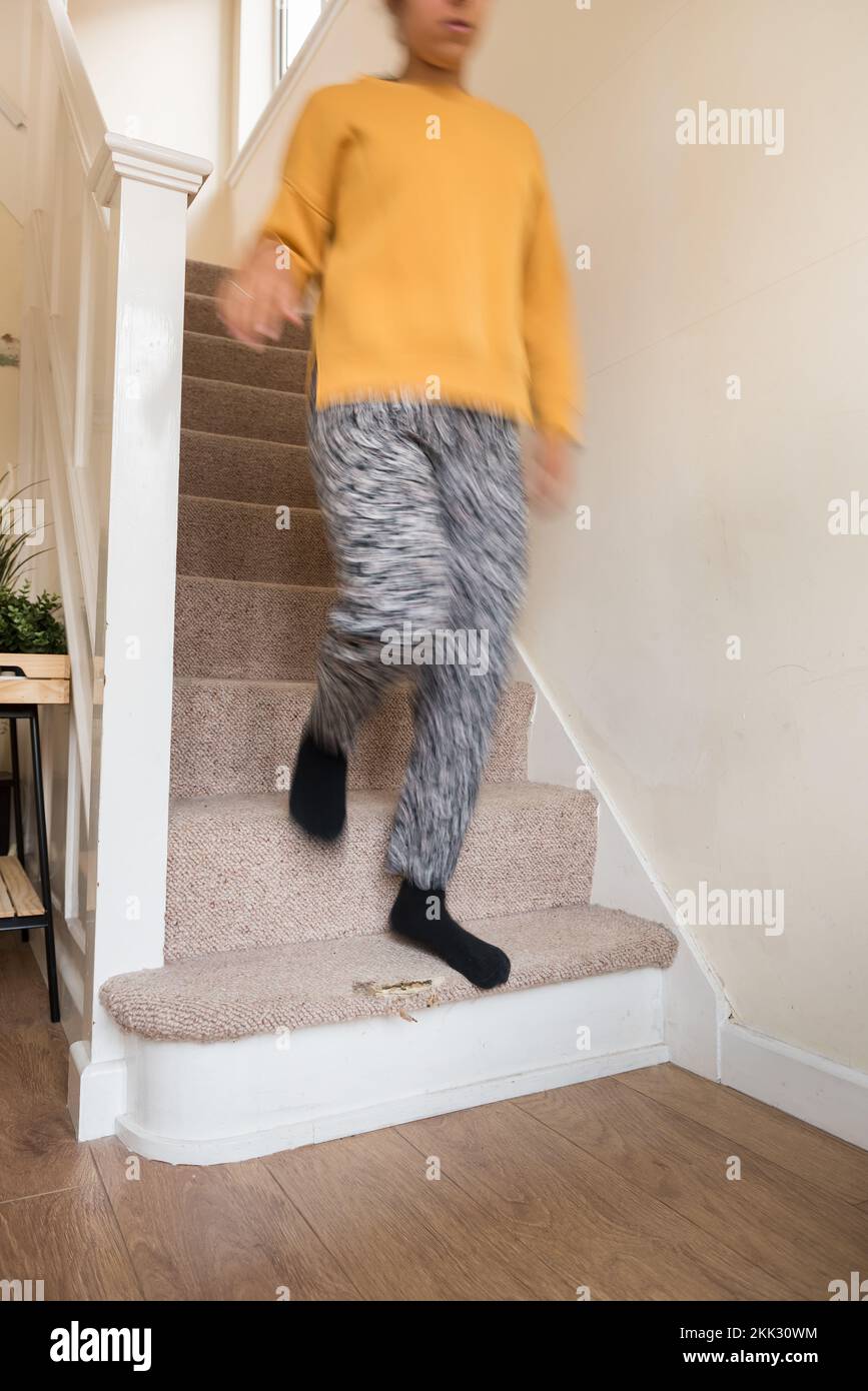 Risk of injury due to tripping or slipping on worn carpet on stairs