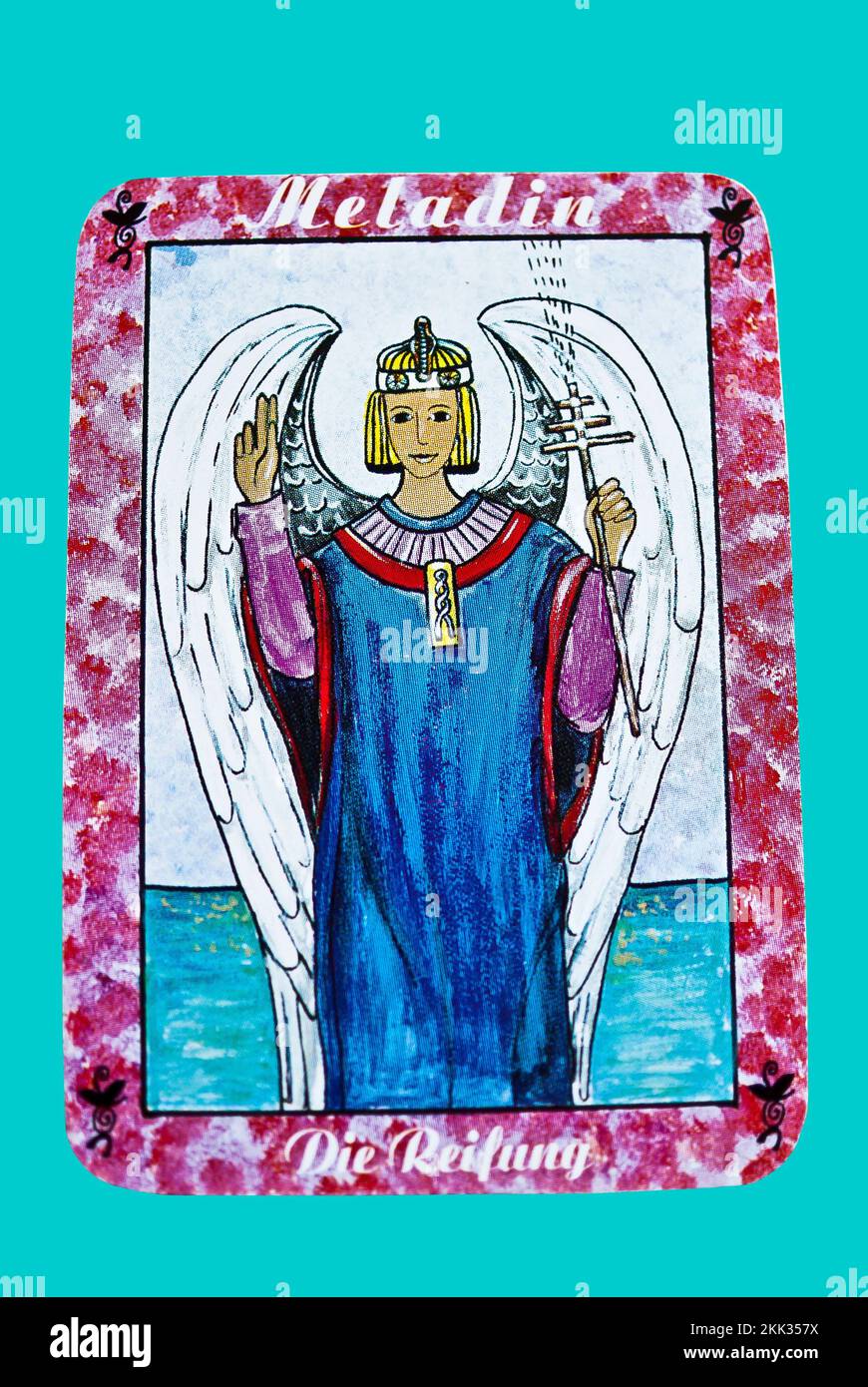 A closeup of an old tarot card on a blue background Stock Photo