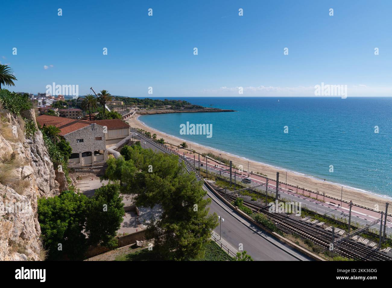 Tarragona Spain beach coast and railway Catalonia with blue Mediterranean sea Stock Photo