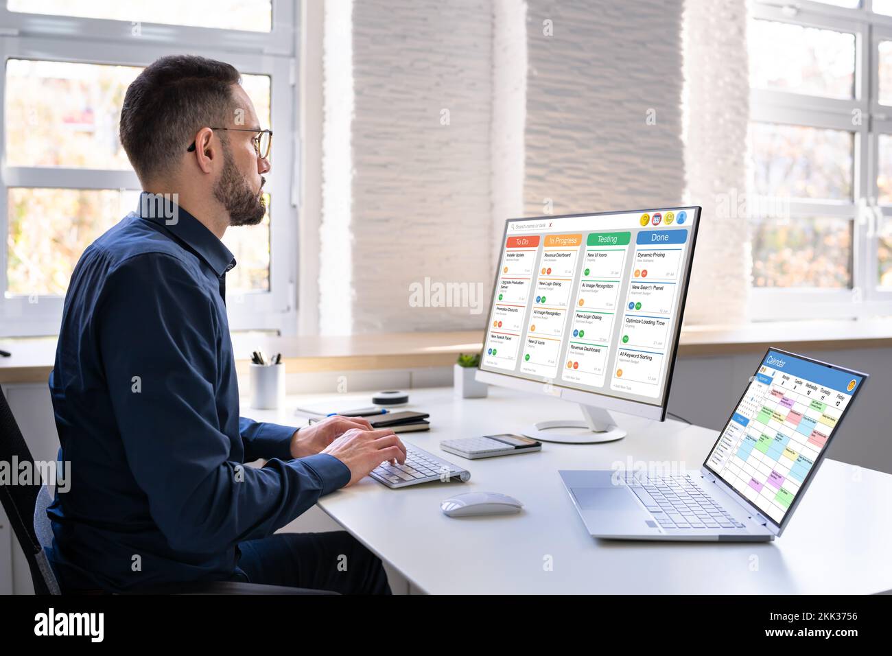 Digital Calendar Schedule Software In Office. Scrum Mobile Phone App Stock Photo