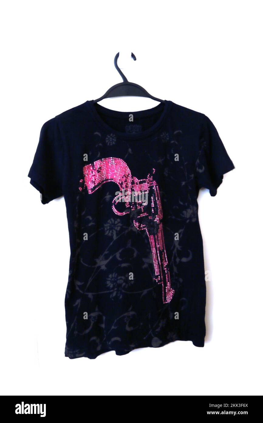Black T-Shirt with Revolver in Pink Stones on the Front Stock Photo