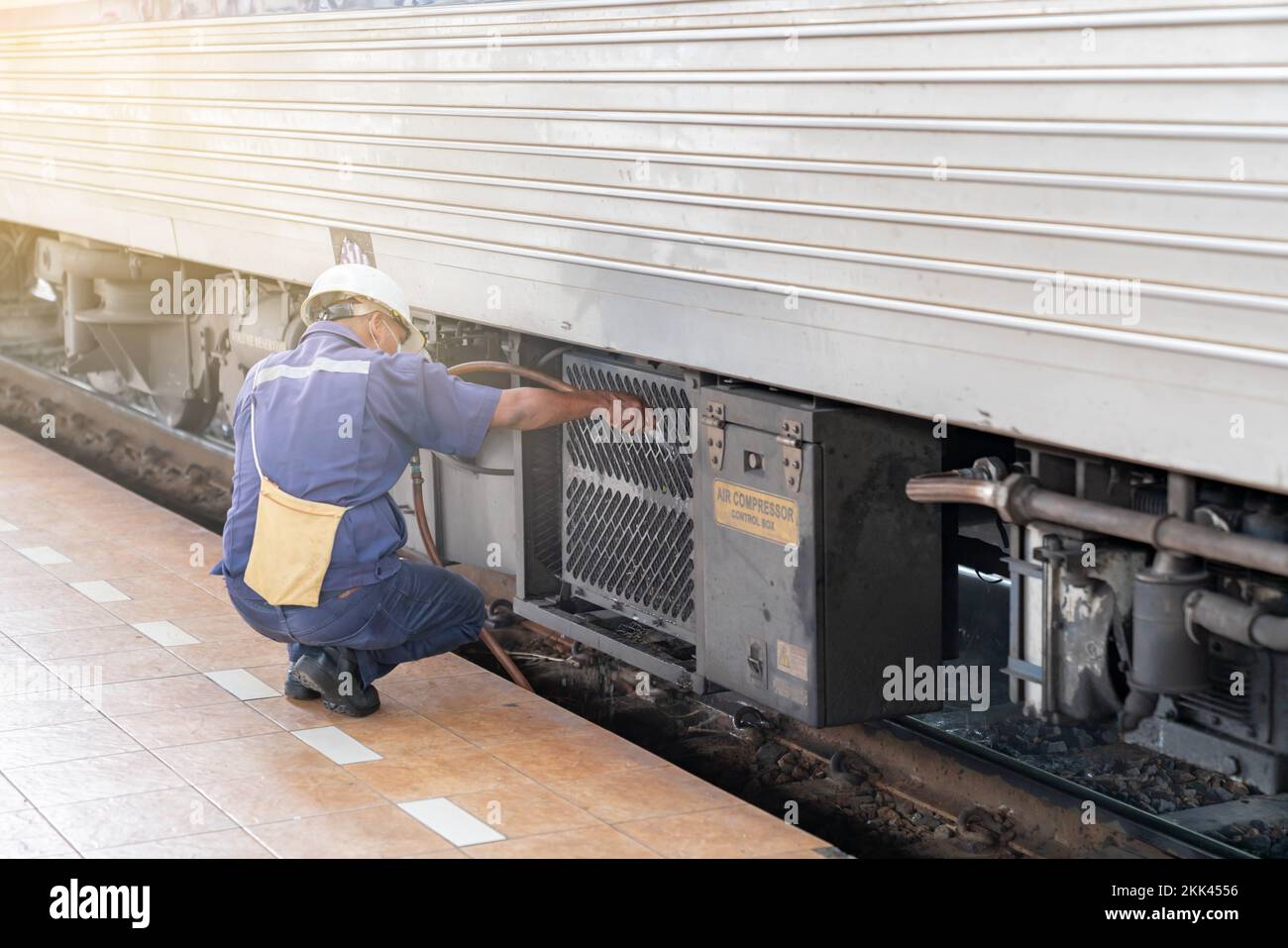 Techician water spray train radiator for reduce temperature after stop in station Stock Photo