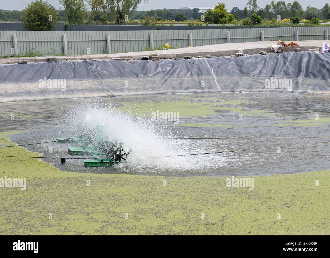 Water turbine fill air into the water for treatment in pond. water treatment system. Stock Photo