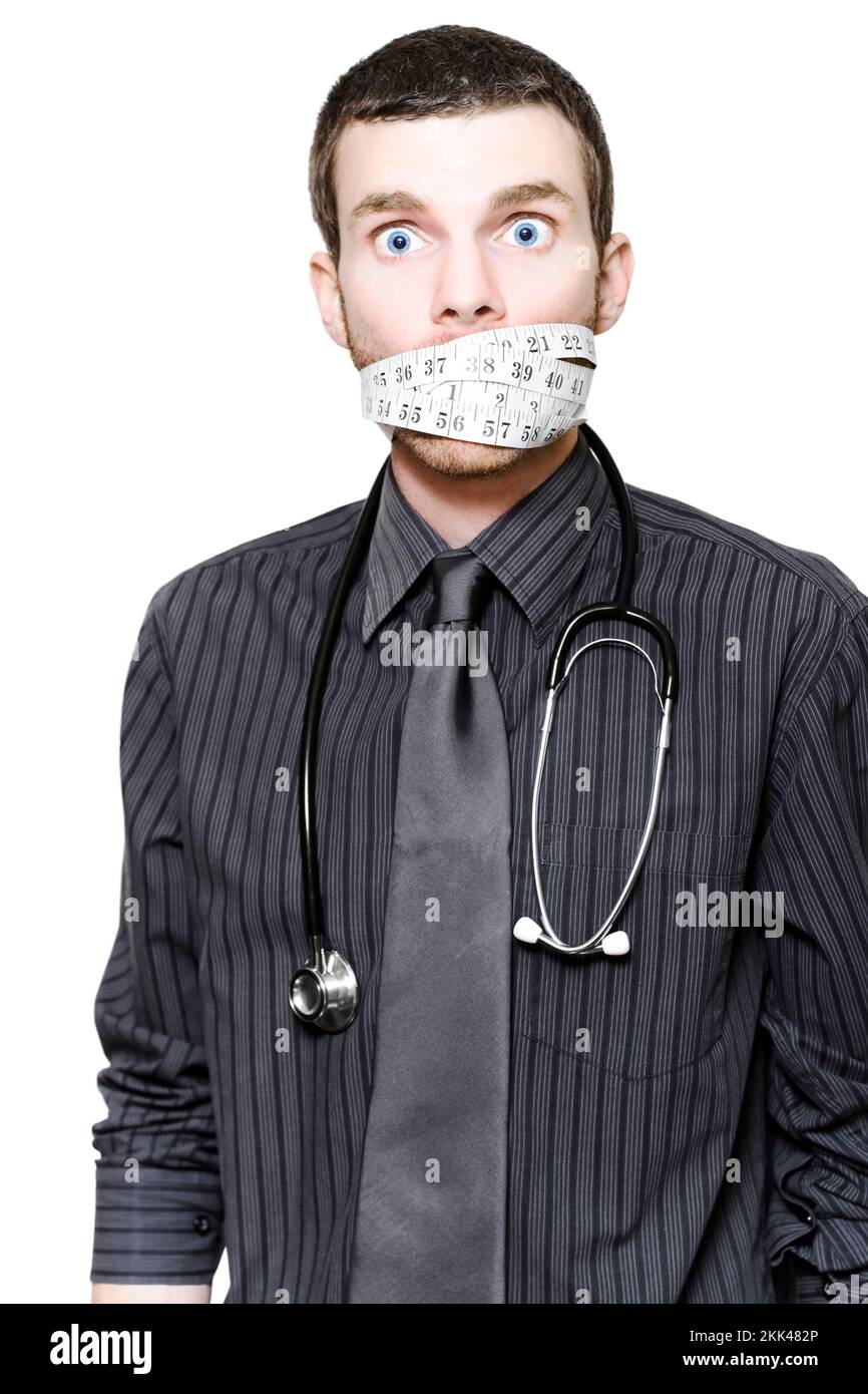Overworked And Stressed Male Doctor Having A Measured Stroke With Tape