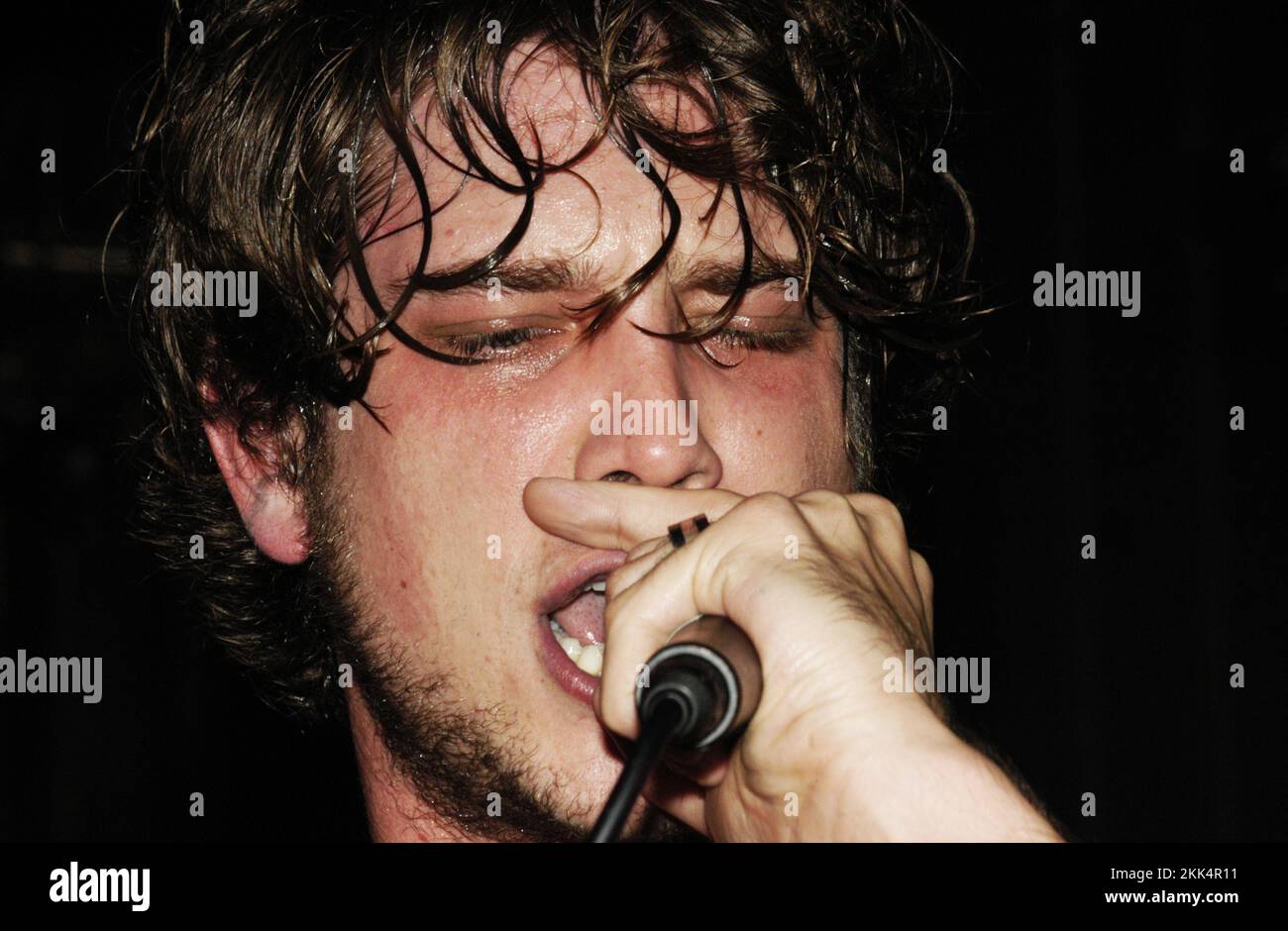 Singer Rooster Singer Nick Atkinson from the pop band ROOSTER playing a sweaty early ...