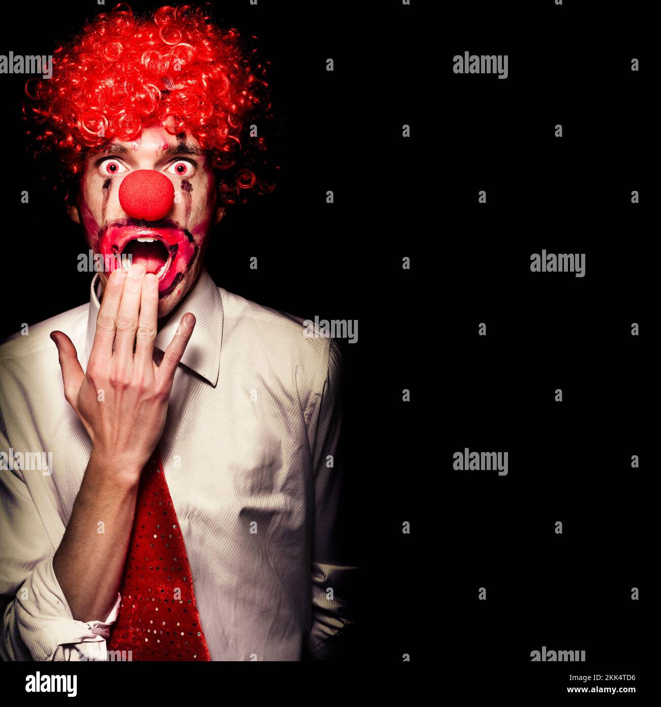 Scary Clown With Shocked Expression Isolated On Black Background Stock