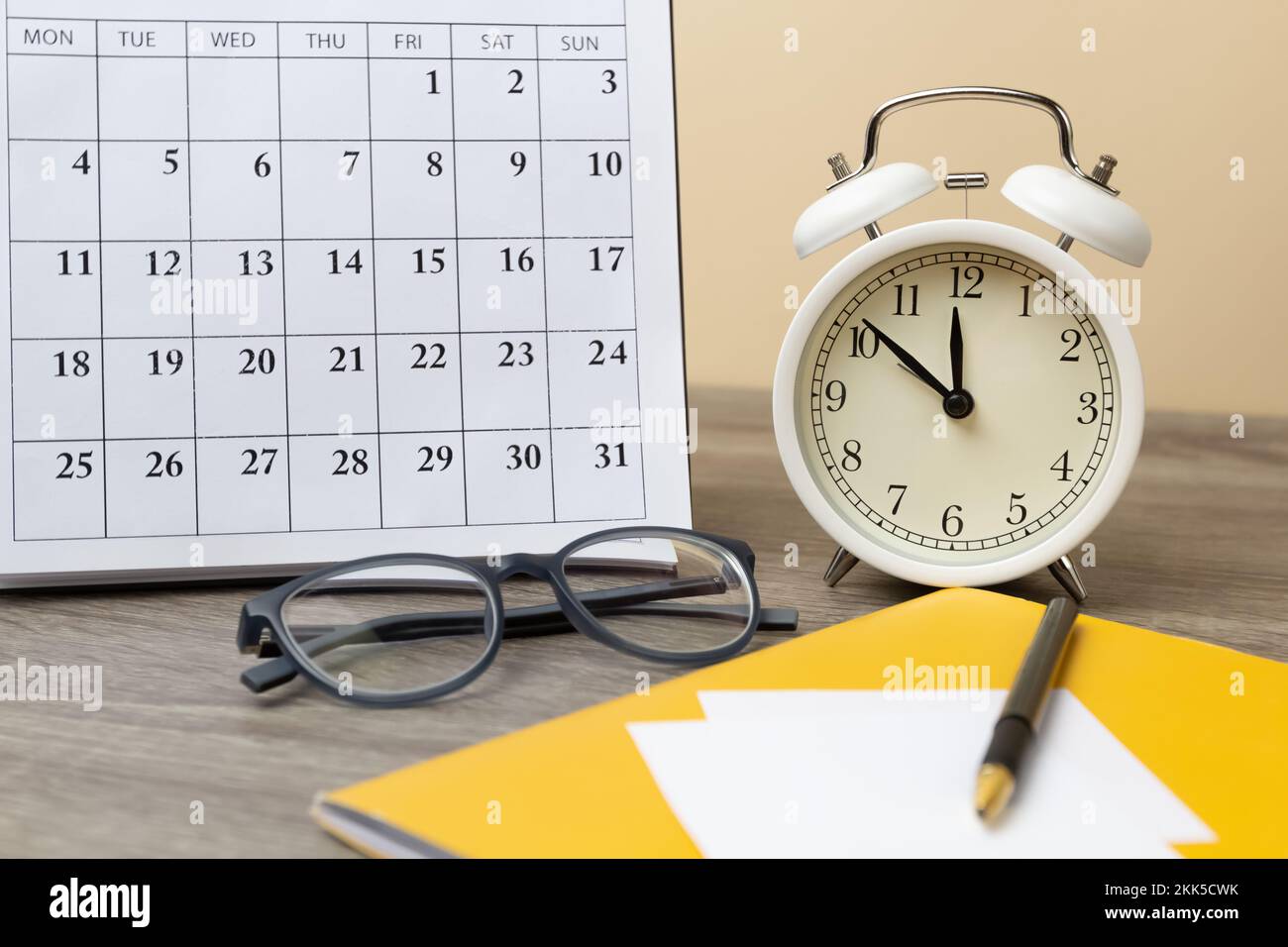 Clock and calendar on the desktop. Time planning concept Stock Photo
