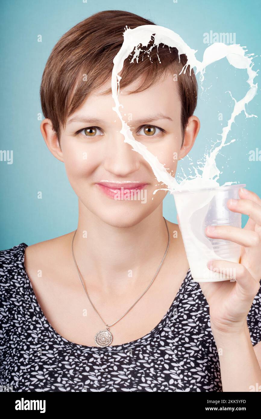 Smiling face of an attractive young nutritionist woman showing the