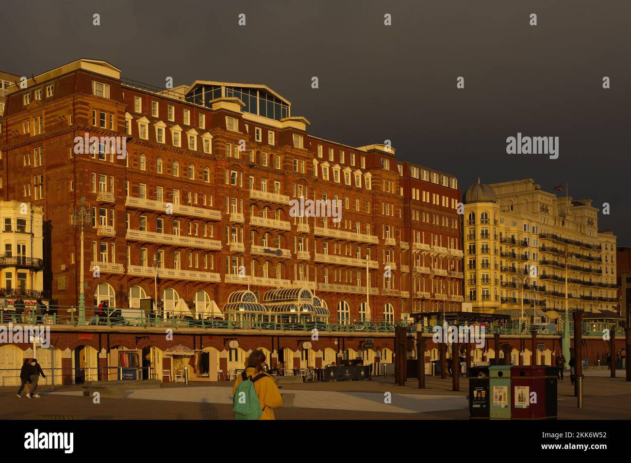 Hilton Metropole and Grand hotels on the seafront promenade at Brighton in East Sussex, England. With dramatic evening sunset light with dark moody sk Stock Photo