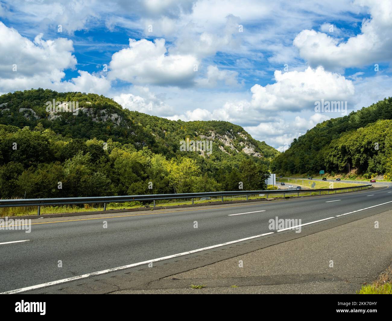 An aerial view of road surrounded by dense trees Stock Photo - Alamy