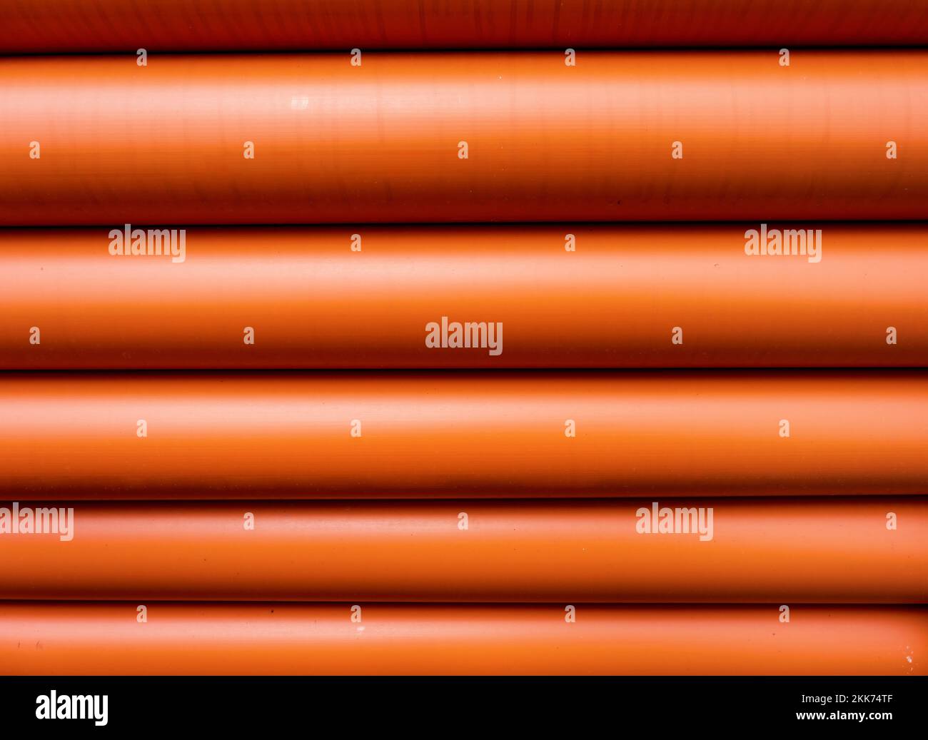 Stack of Orange pipe made of polyvinyl chloride Stock Photo Alamy