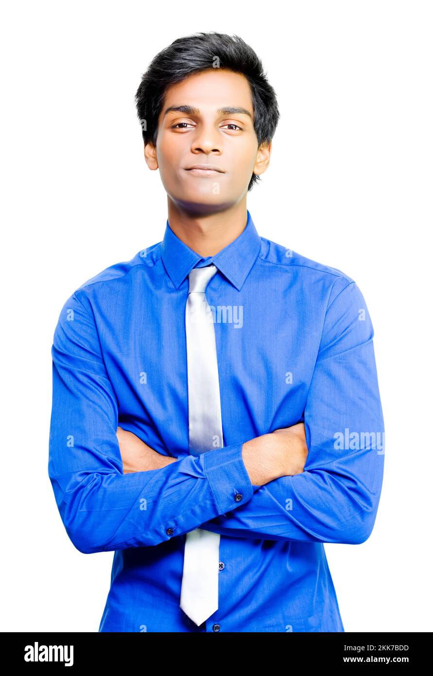 Happy young Asian male business person standing smiling with his arms