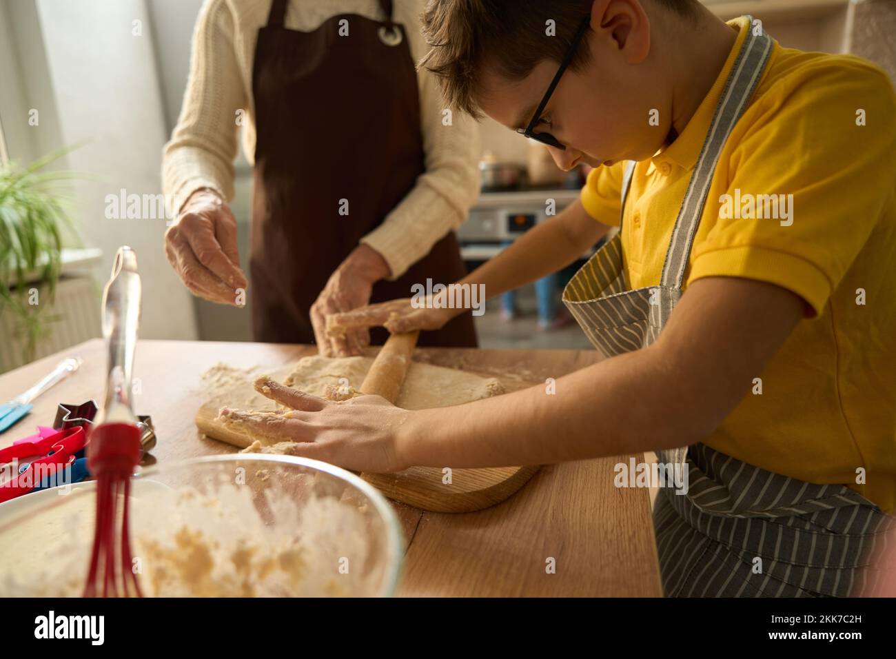 Close up photo of boy cooking at home Stock Photo