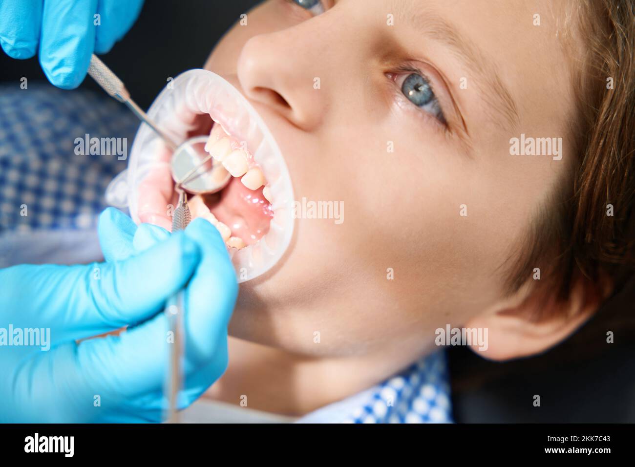 Child undergoes an oral examination in an outpatient clinic Stock Photo