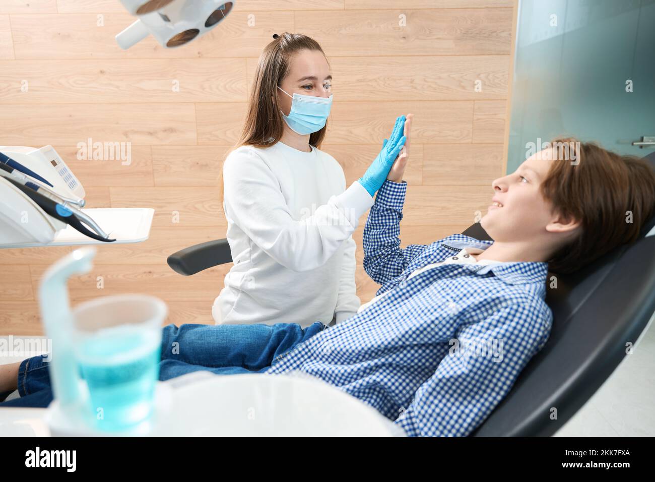 Boy on examination at a woman dentist Stock Photo
