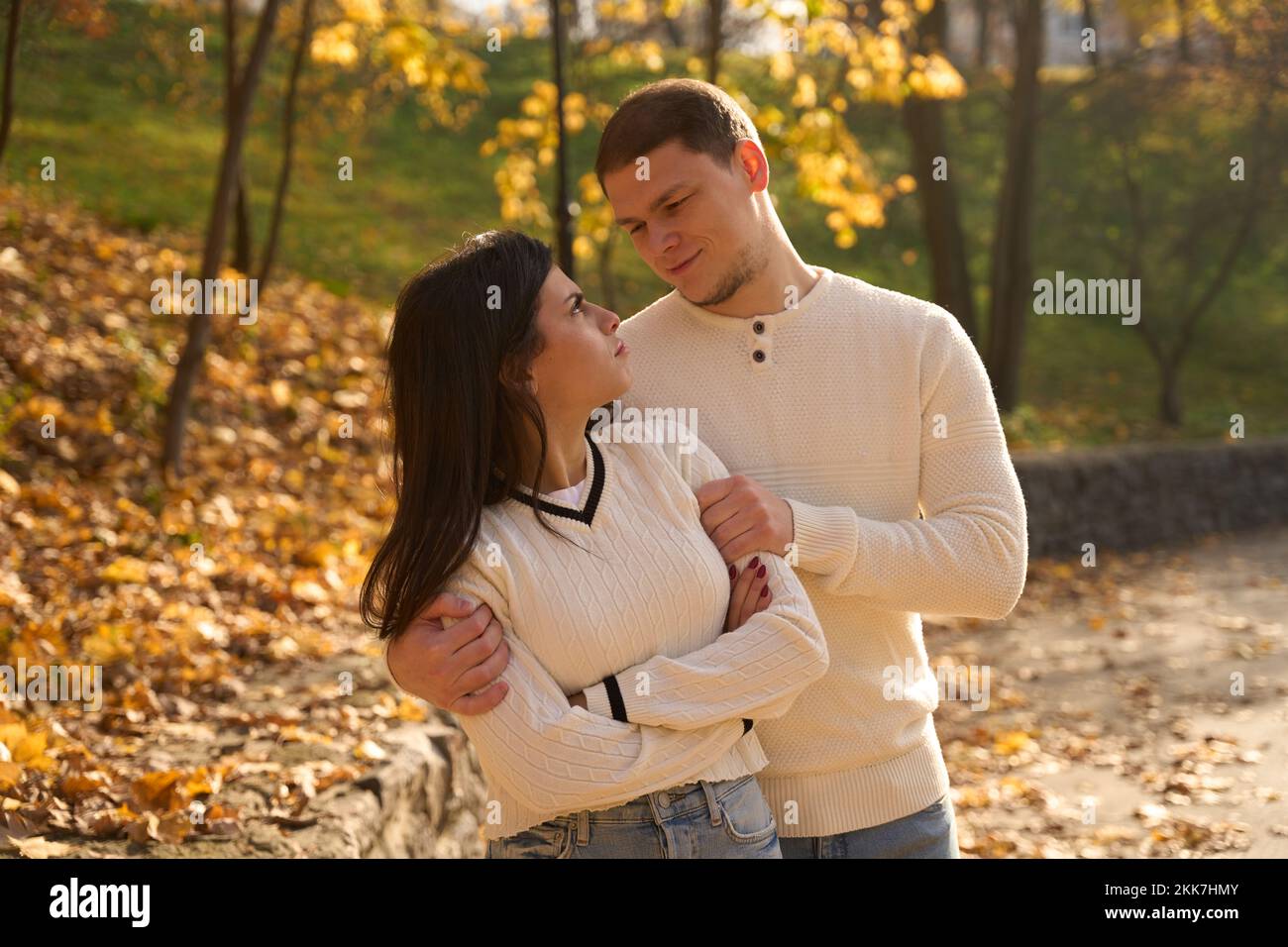 Smiling guy with a slight unshaven gently hugged his girlfriend Stock Photo