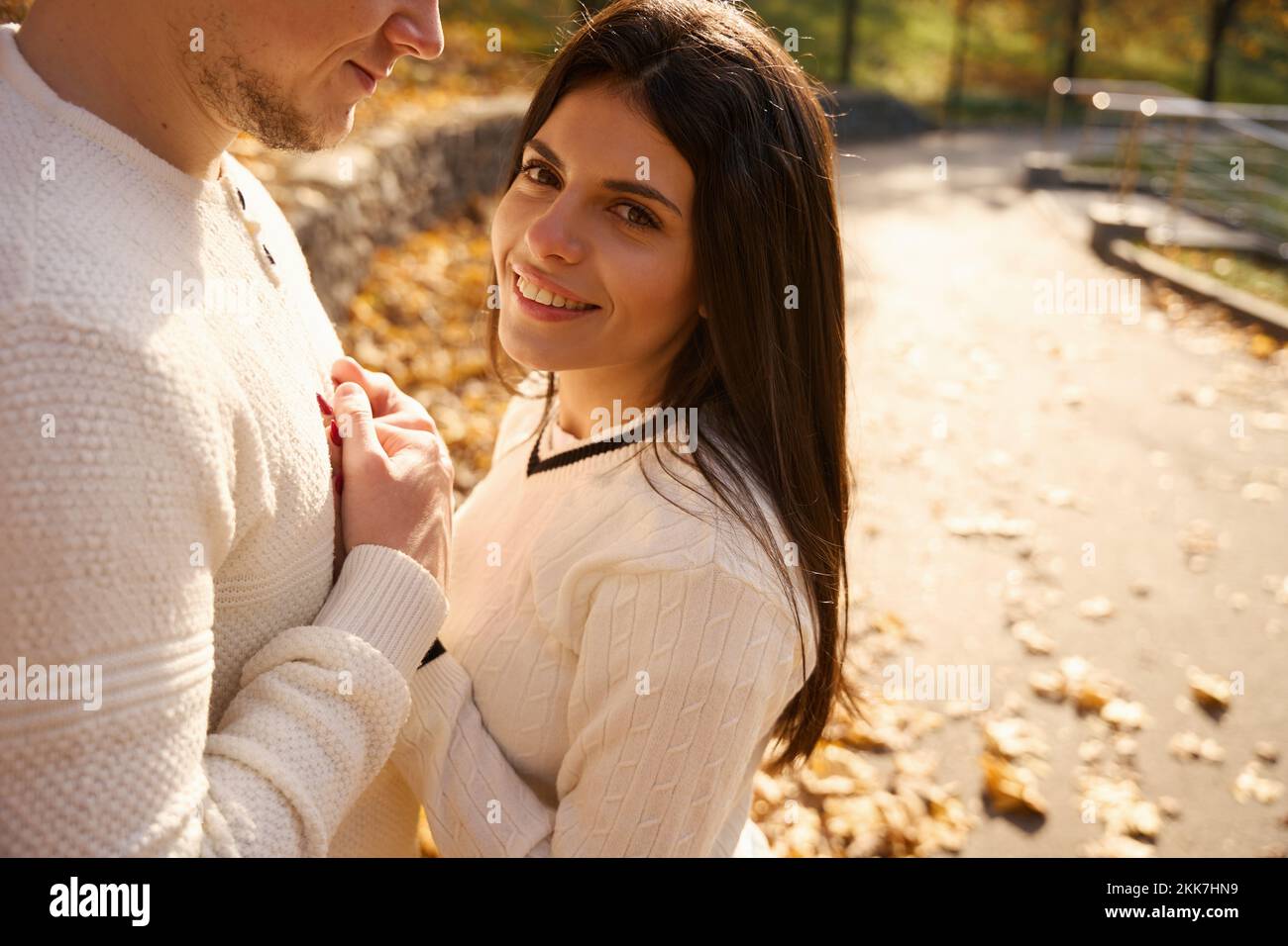Happy young woman put her hands on her friend chest Stock Photo