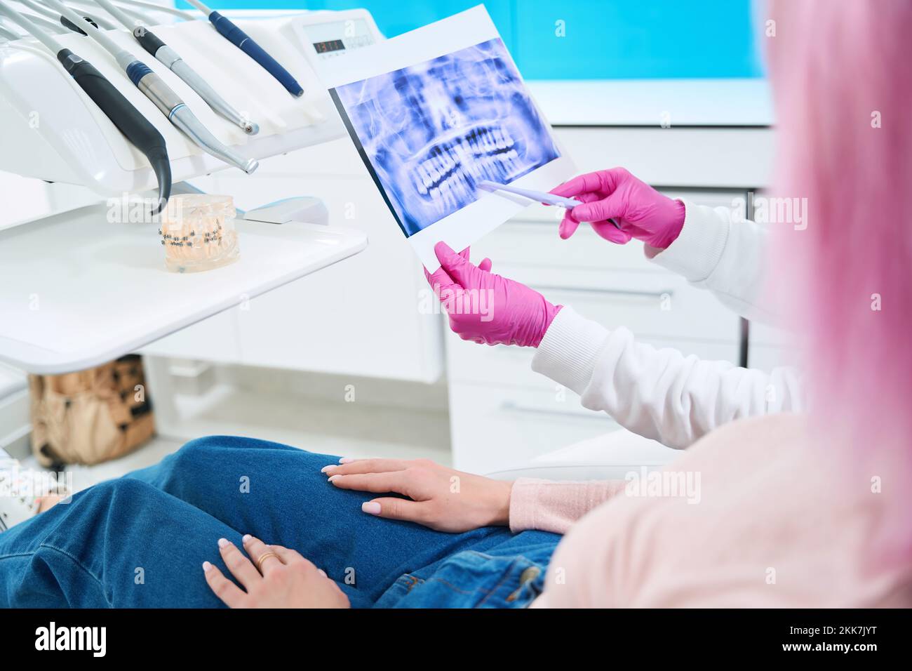 Orthodontist specialist demonstrates an xray of the dentition to