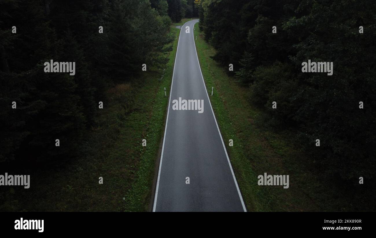 Aerial dark road in woods hi-res stock photography and images - Alamy