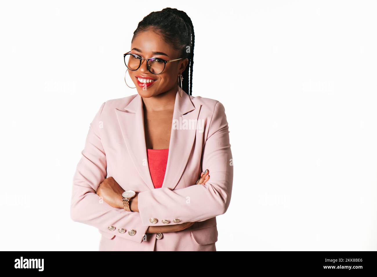 Young beautiful African American business woman in suit smiling in ...