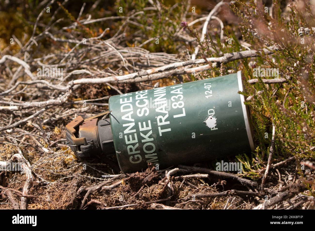 Discarded military munitions on burnt heathland. Hankley Common, Surrey ...