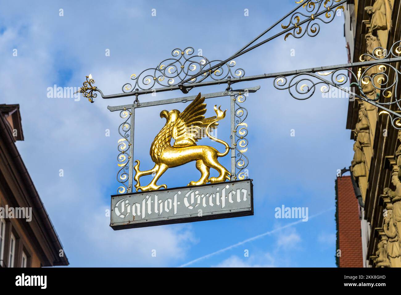 Rothenburg ob der Tauber, Germany - January 15, 2014: Medieval shop signage Gasthof Greifen engl: restaurant griffon , with griffon in gold symbolizin Stock Photo