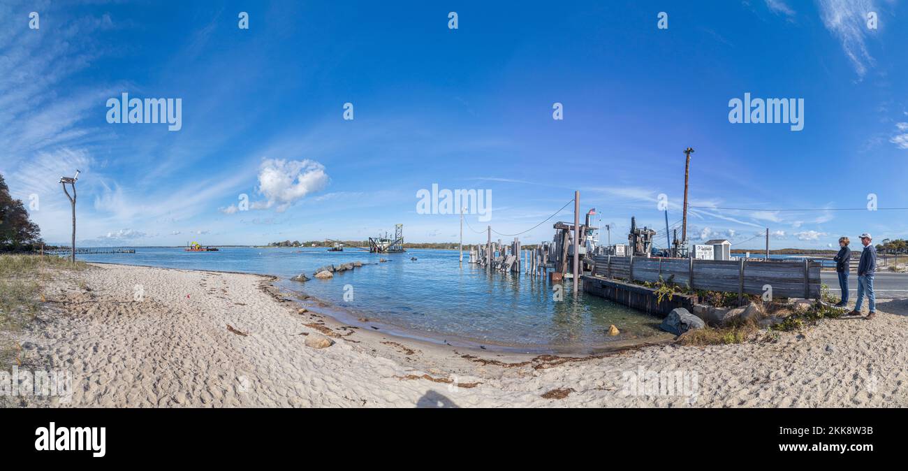 scenic view to beach and harbor of Sag Harbor in afternoon light Stock Photo