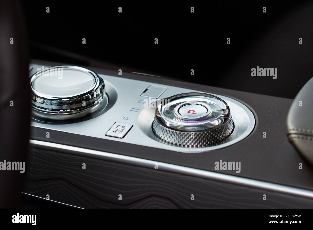 Parking brake of a modern car. Electronic handbrake. Modrn car hand brake, parking button. EPB