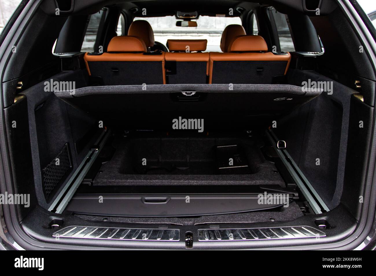 Huge, clean and empty car trunk in interior of compact suv. Rear view