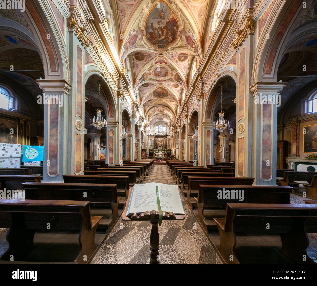 Boves, Italy - November 22, 2022: interior with frescoed vaults of parish church of san Bartolomeo with missal liturgical book in  foreground Stock Photo