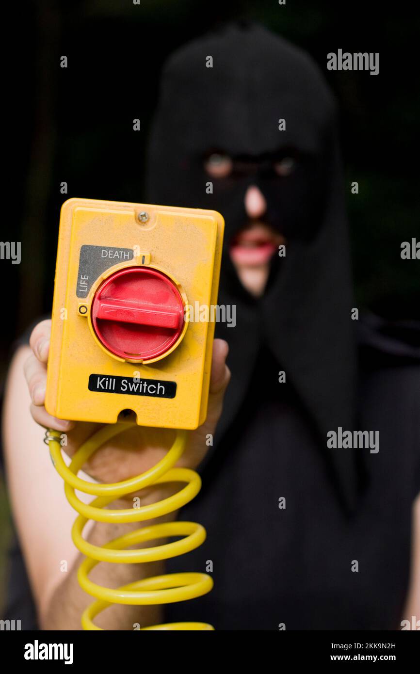 Kill Switch Executioner Holding The Electrical Switch Of Life And Death Stock Photo