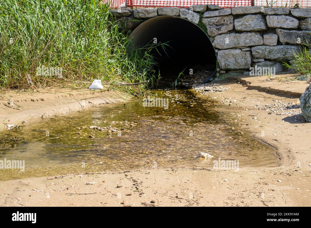 A discharge of sewage on the beach during daytime Stock Photo Alamy