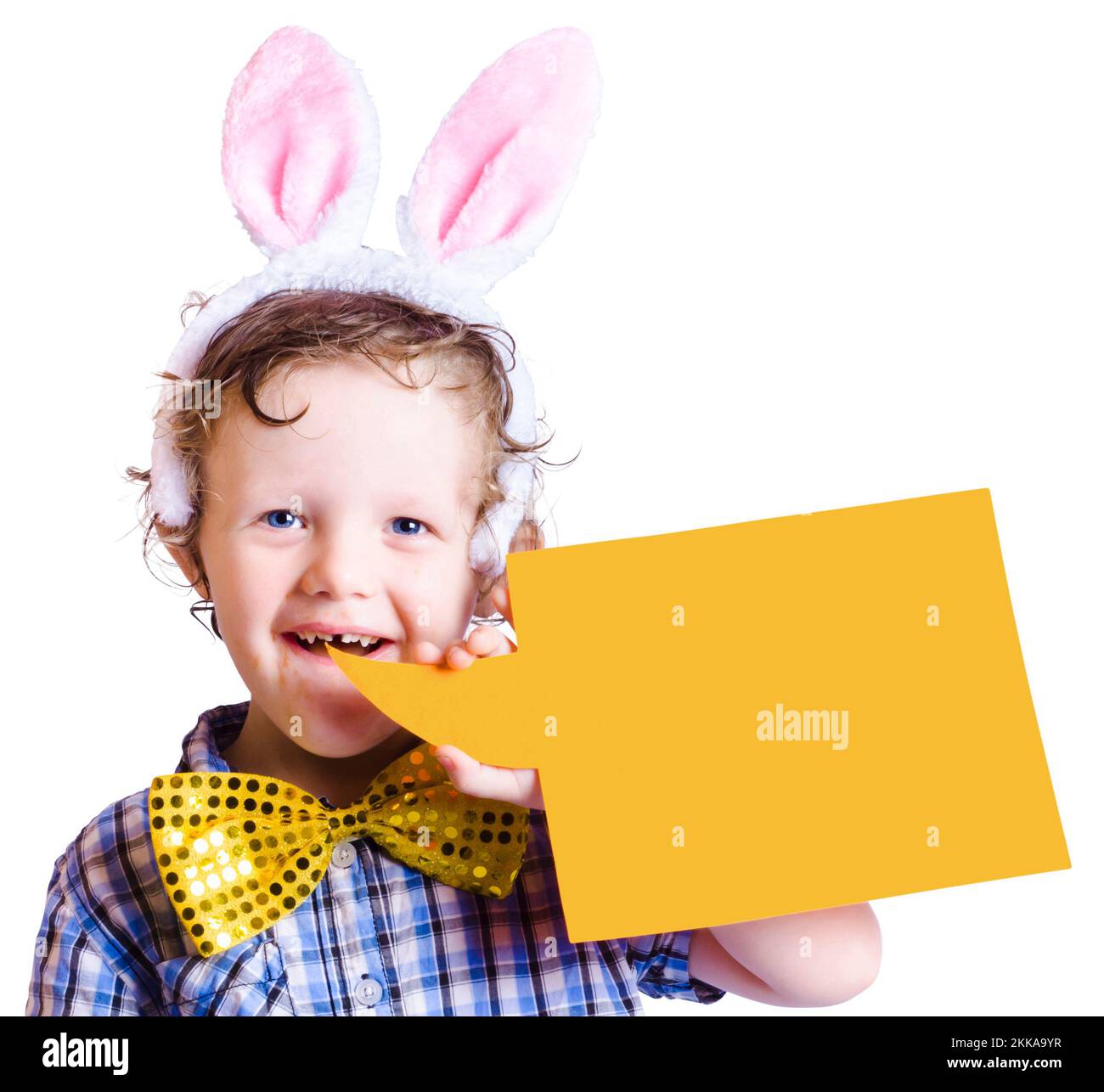 Smiling young boy wearing pink bunny ears of an Easter bunny with blank