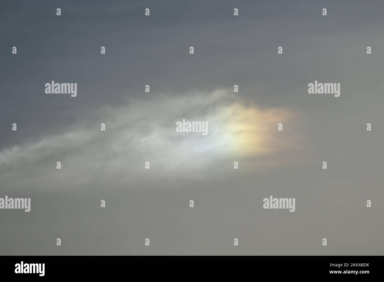 Cloud refracting in rainbow colors Stock Photo
