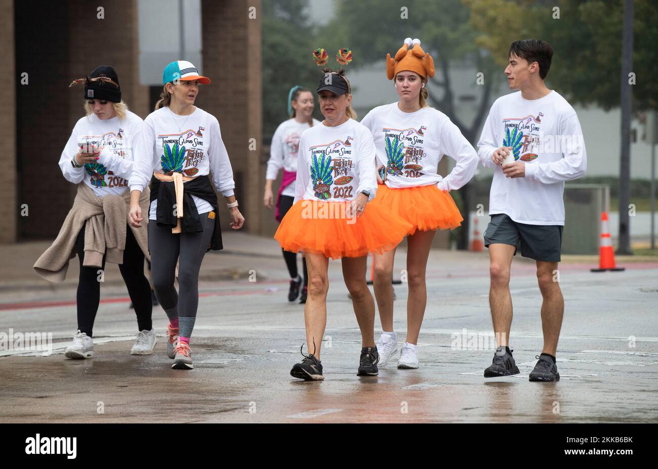 Austin Texas USA, November 24 2022: Some of more than 20,00 runners and walkers participate in the 32nd annual Thundercloud Subs Turkey Trot, a five mile event through downtown Austin. Runners braved a slight drizzle and cooler temperatures that made a pleasant morning activity before the traditional Thanksgiving dinner. ©Bob Daemmrich Stock Photo