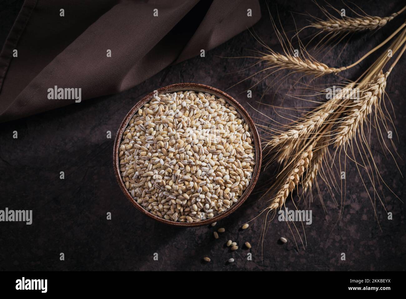 Organic uncooked dried barley cereal grain in a bowl Stock Photo Alamy