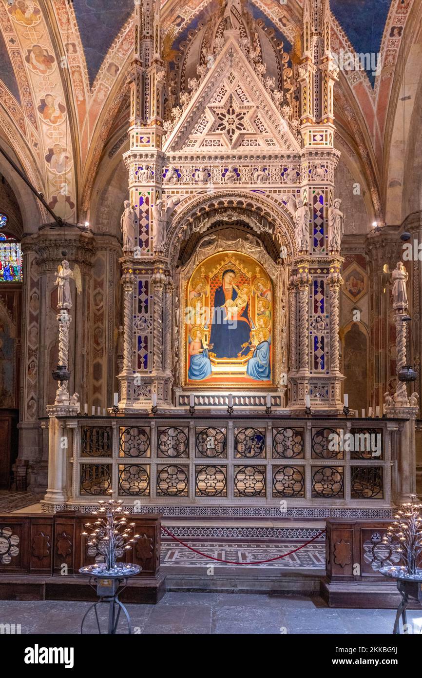 Florence, Italy - August 13, 2019: Interior of the Church of Orsanmichele, with the Andrea Orcagna's bejeweled Gothic Tabernacle, Florence, Italy. Stock Photo